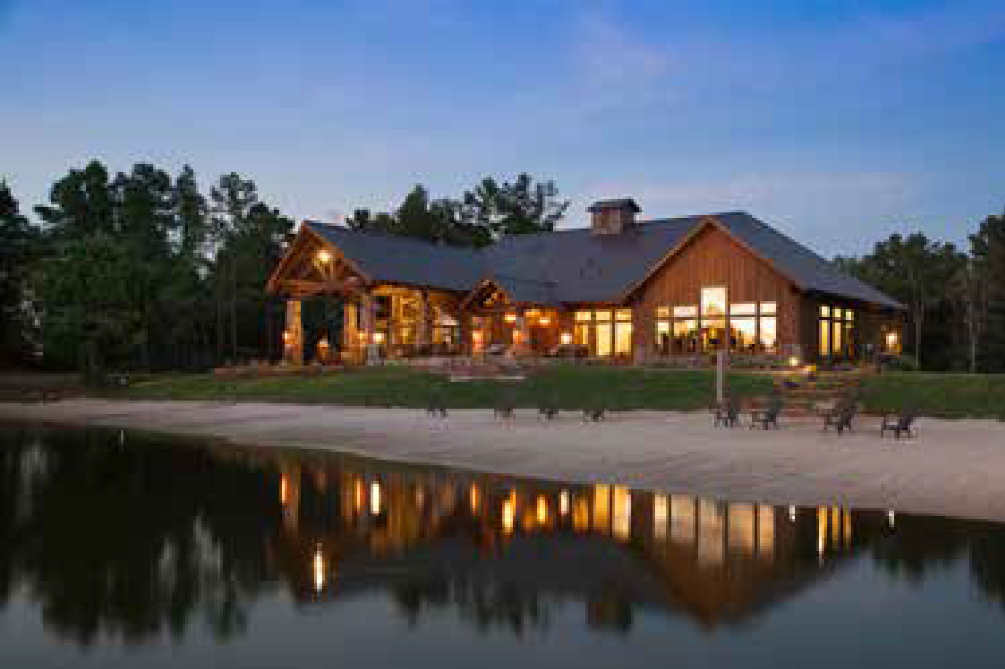 Community amenity center at dusk by the water